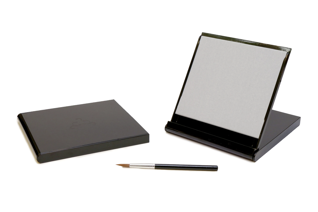 Mini folding grey Buddha board in a black case with paintbrush
