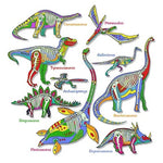 Load image into Gallery viewer, T-shirt design depicting glow in the dark dinosaur skeletons against illustrated dinosaurs including: camarasaurus, pteranodon, tyrannosaurus, gallimimus, archaeopteryx,  stegosaurus, plesiosaurus, brachiosaurus, and styracosaurus.
