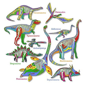 T-shirt design depicting glow in the dark dinosaur skeletons against illustrated dinosaurs including: camarasaurus, pteranodon, tyrannosaurus, gallimimus, archaeopteryx,  stegosaurus, plesiosaurus, brachiosaurus, and styracosaurus.