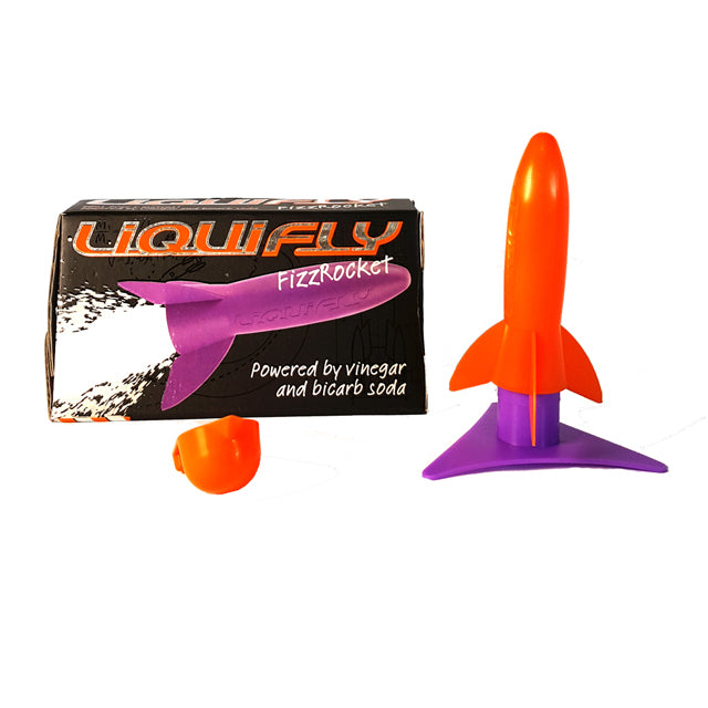 Liquifly rocket posed next to retail packaging which reads "Liquifly FizzRocket: Powered by vinegar and bicarb soda" and illustrates a purple plastic rocket in flight